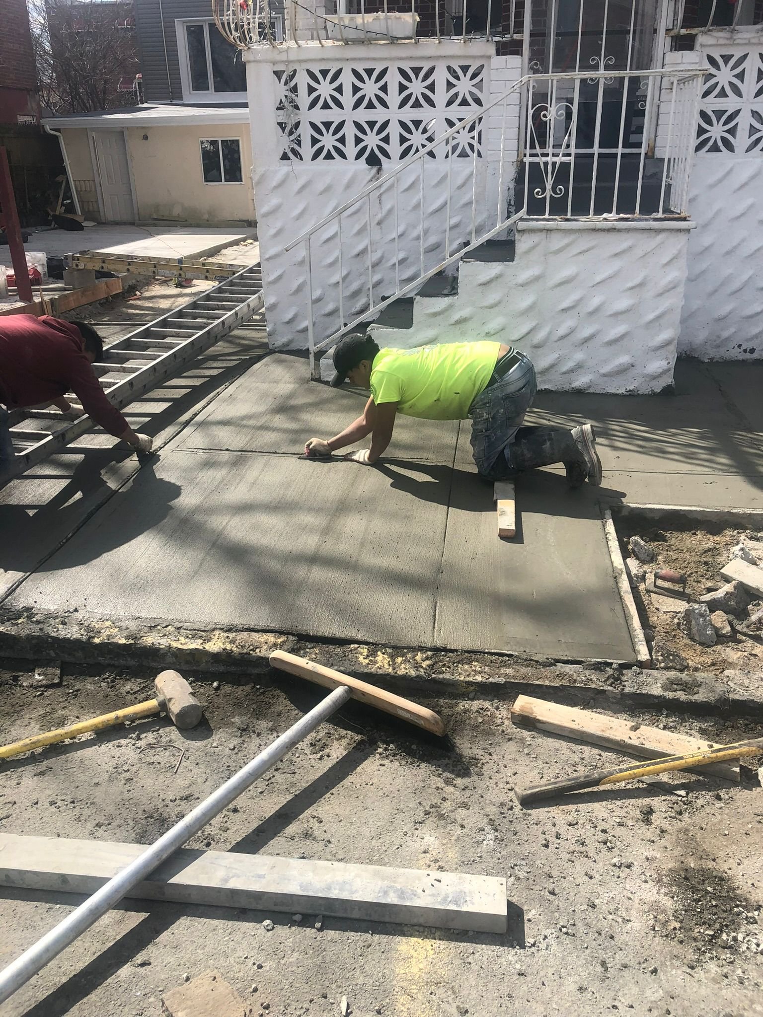 Stamped concrete surface with decorative patterns resembling stone or brick.