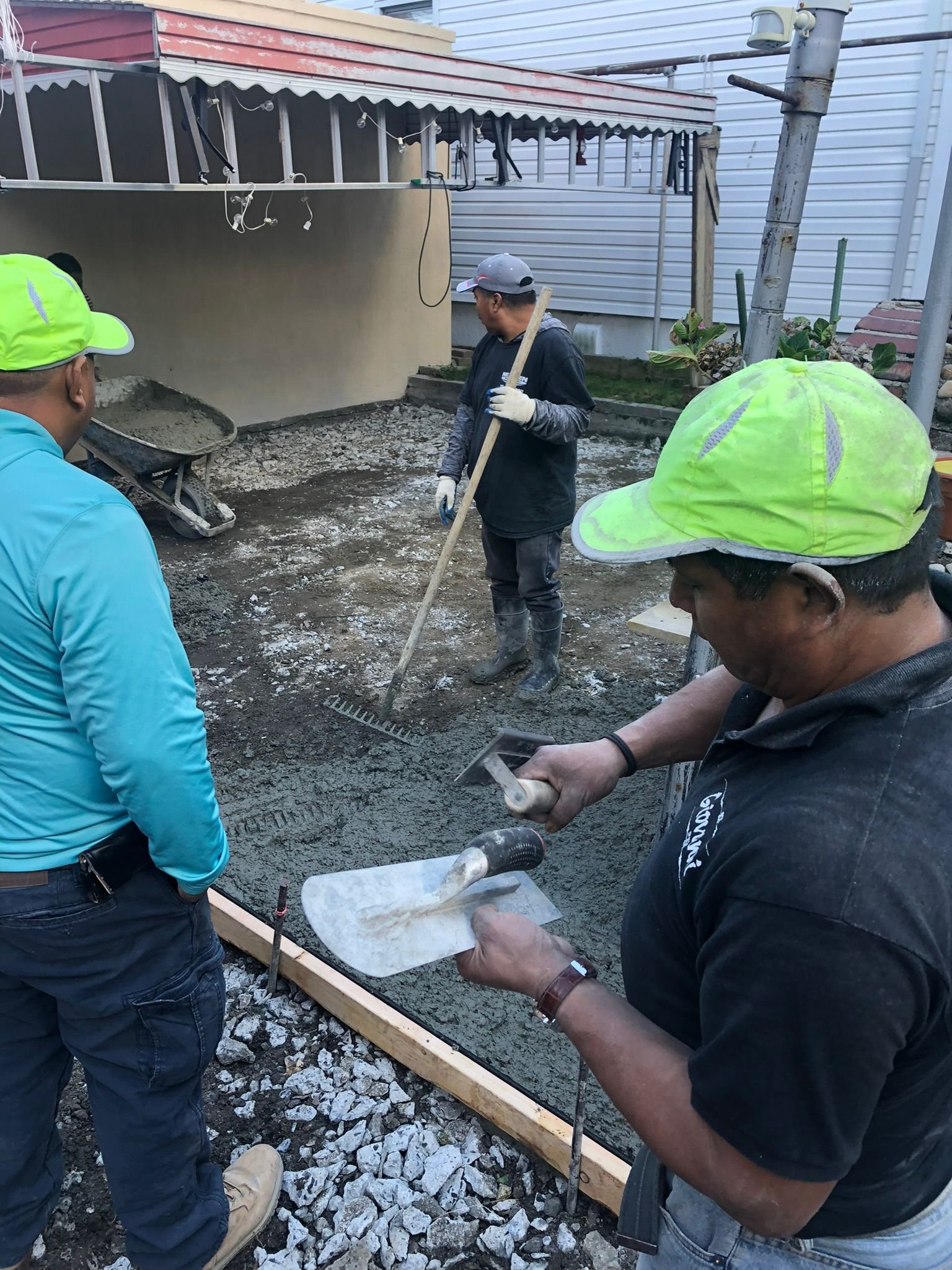 Workers completing concrete construction services such as driveways, patios, sidewalks, slabs, foundations, steps, repairs, and leveling in Westchester, NY.
