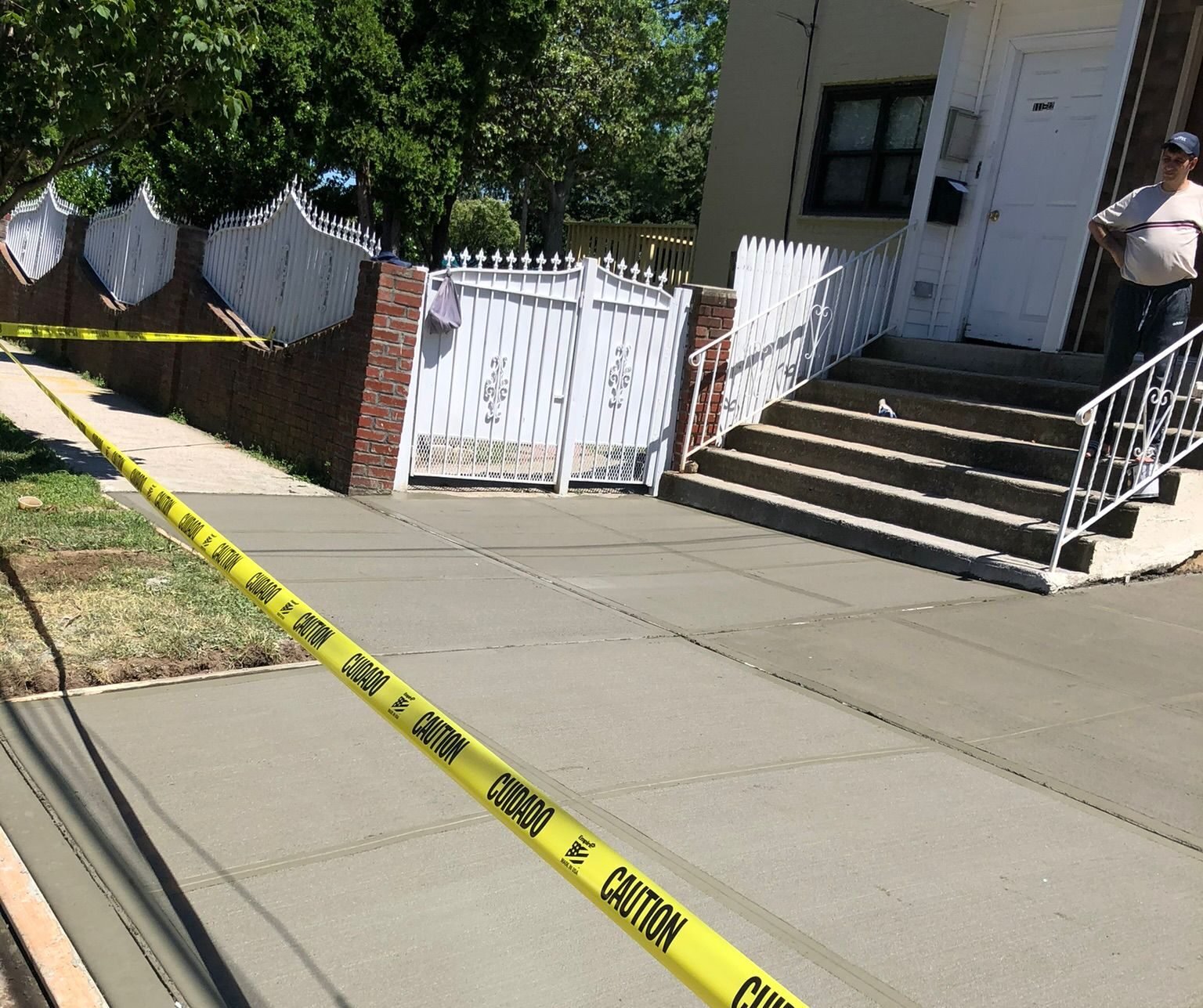 Construction crew working on various concrete projects—driveways, patios, sidewalks, foundations, steps, slabs, and repairs—at residential and commercial sites in Mount Vernon, NY.