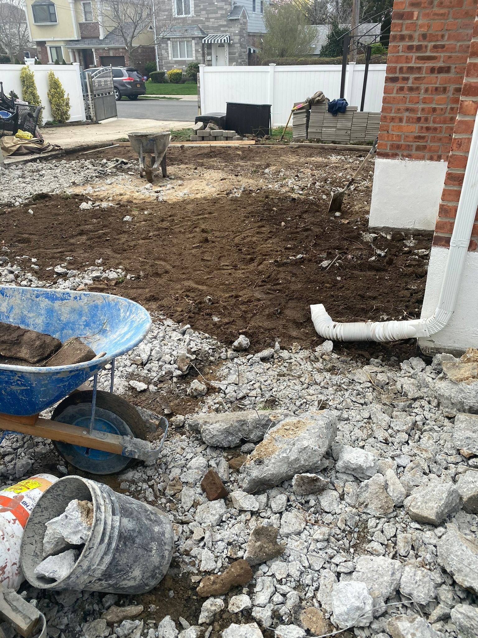 Workers performing concrete construction services such as driveways, patios, sidewalks, slabs, foundations, repairs, and leveling in New Rochelle, NY.