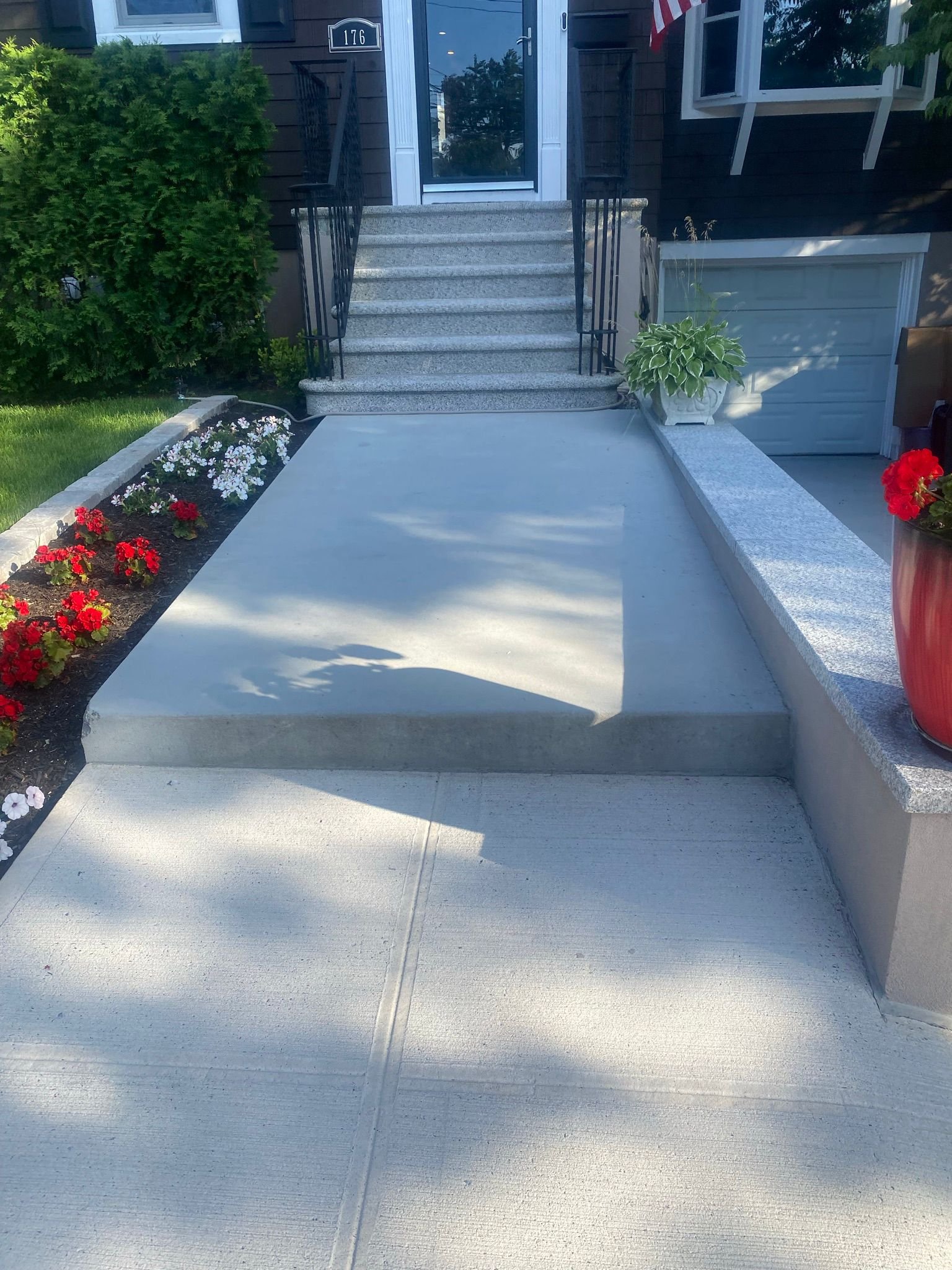 New concrete steps being formed and finished at the front of a Bronx home.