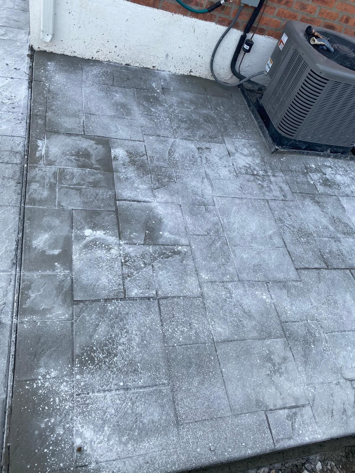 Construction crew working on various concrete projects—driveways, patios, sidewalks, foundations, steps, slabs, and repairs—at residential and commercial sites in Mount Vernon, NY.