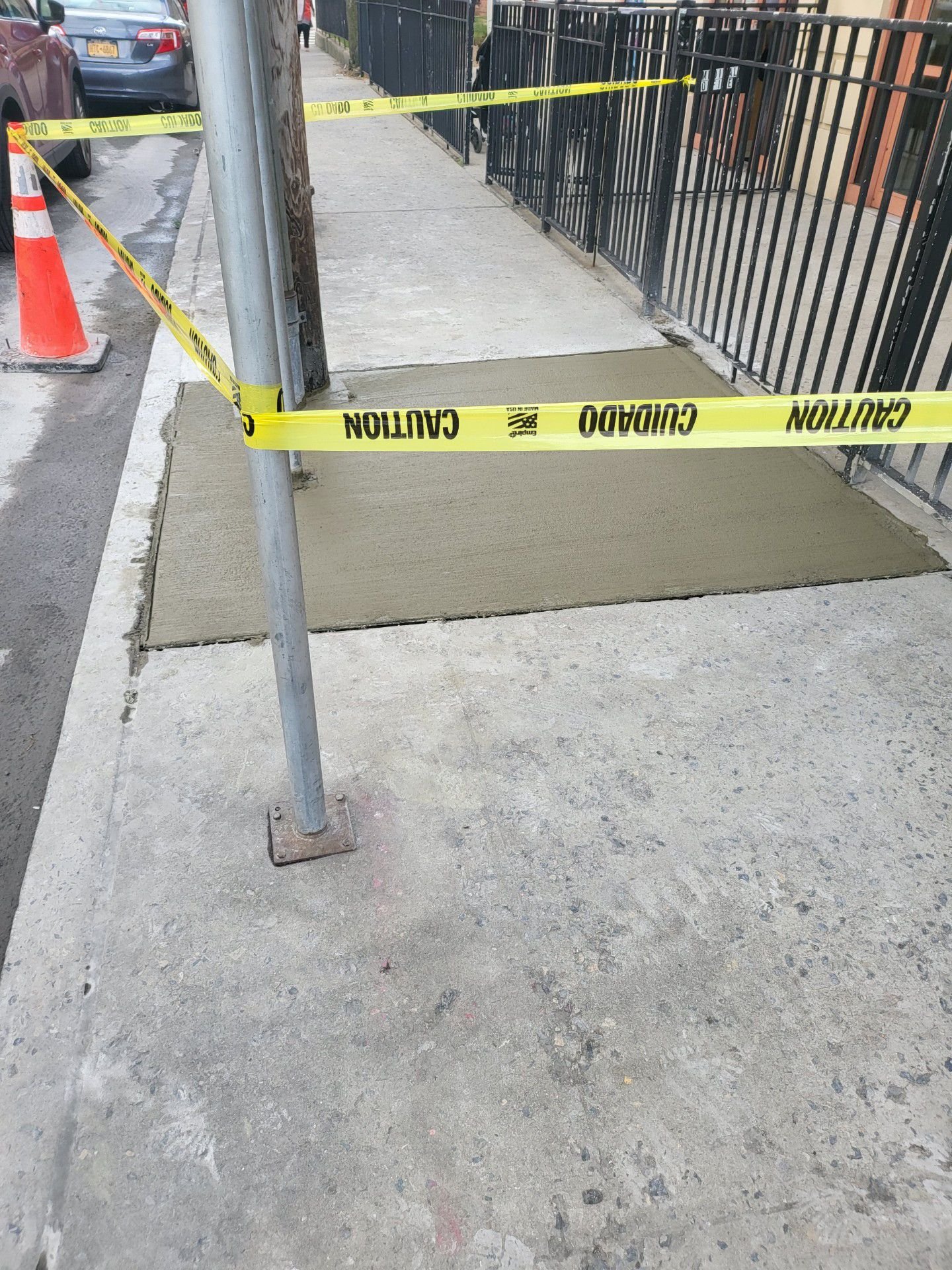 Workers performing concrete construction services such as driveways, patios, sidewalks, slabs, foundations, steps, repairs, and leveling in Queens, NY.