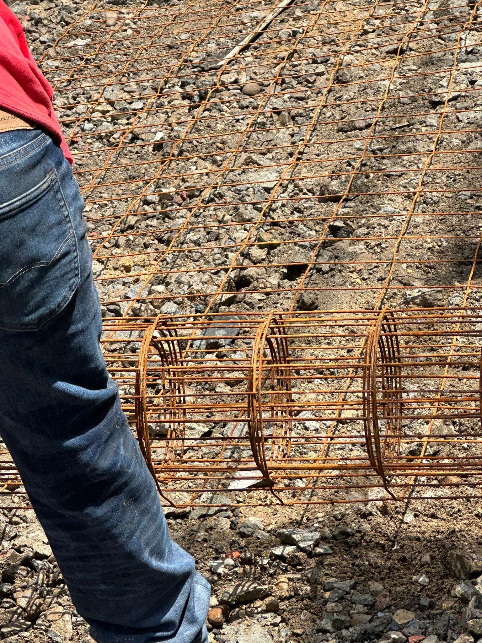 Workers installing, repairing, or finishing concrete surfaces on residential and commercial properties in New York City.