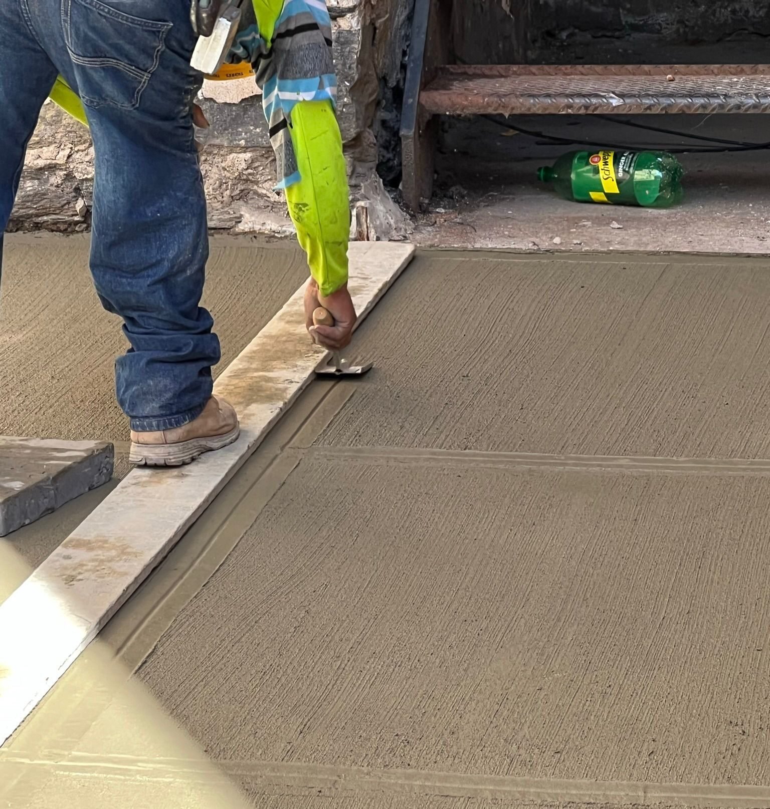 Construction crew working on various concrete projects—driveways, patios, sidewalks, foundations, steps, slabs, and repairs—at residential and commercial sites in Mount Vernon, NY.