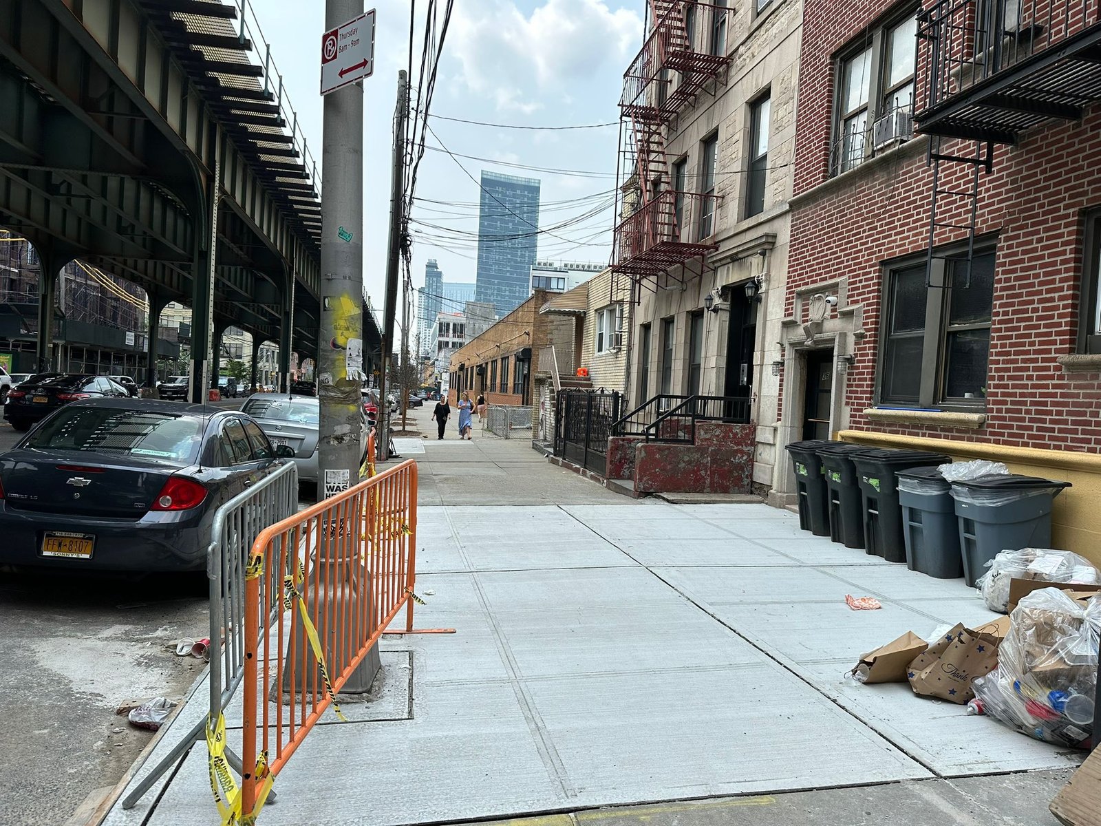 NYC street view and a list of New York City boroughs/neighborhoods served for construction.